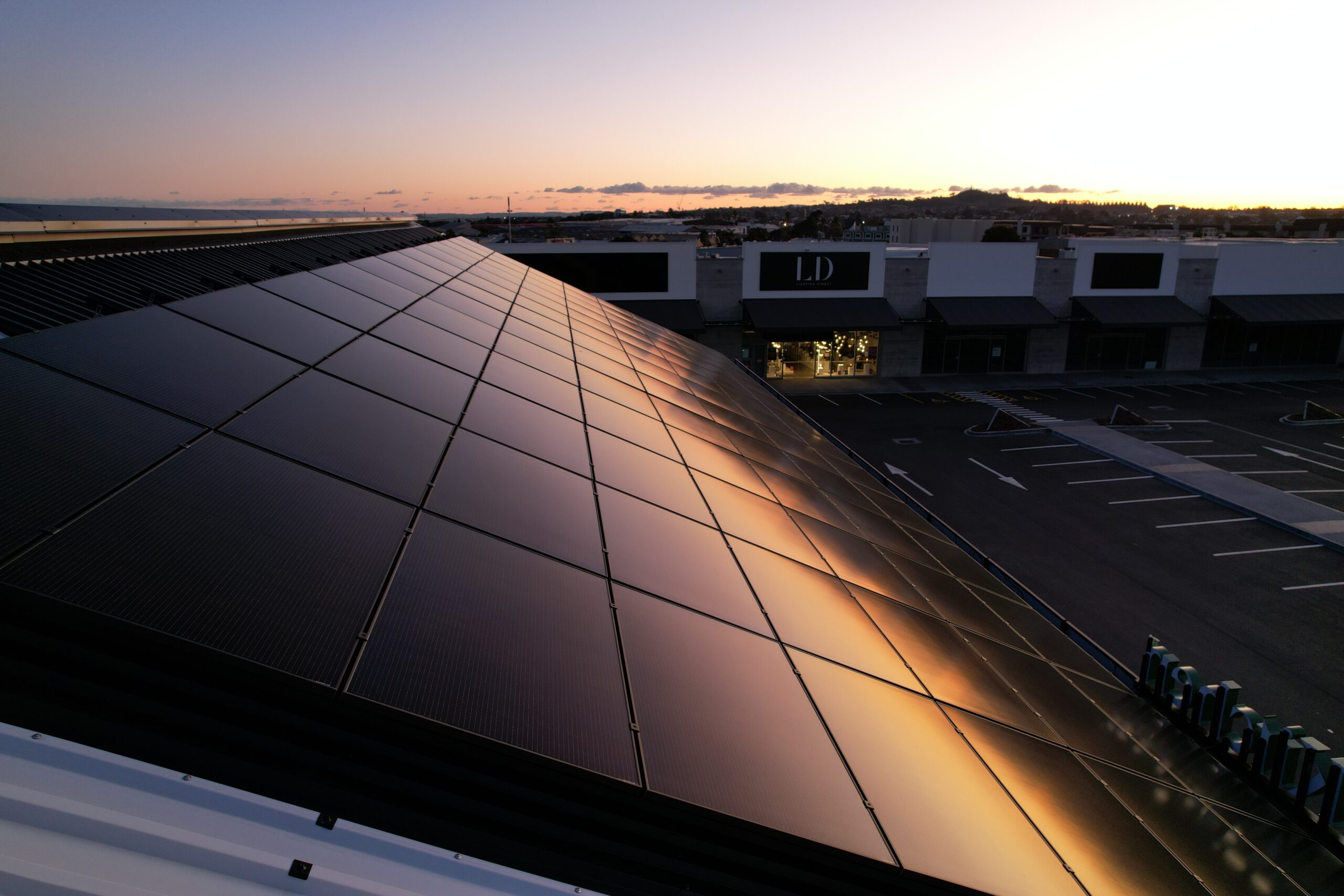 Black solar roof in the sunset